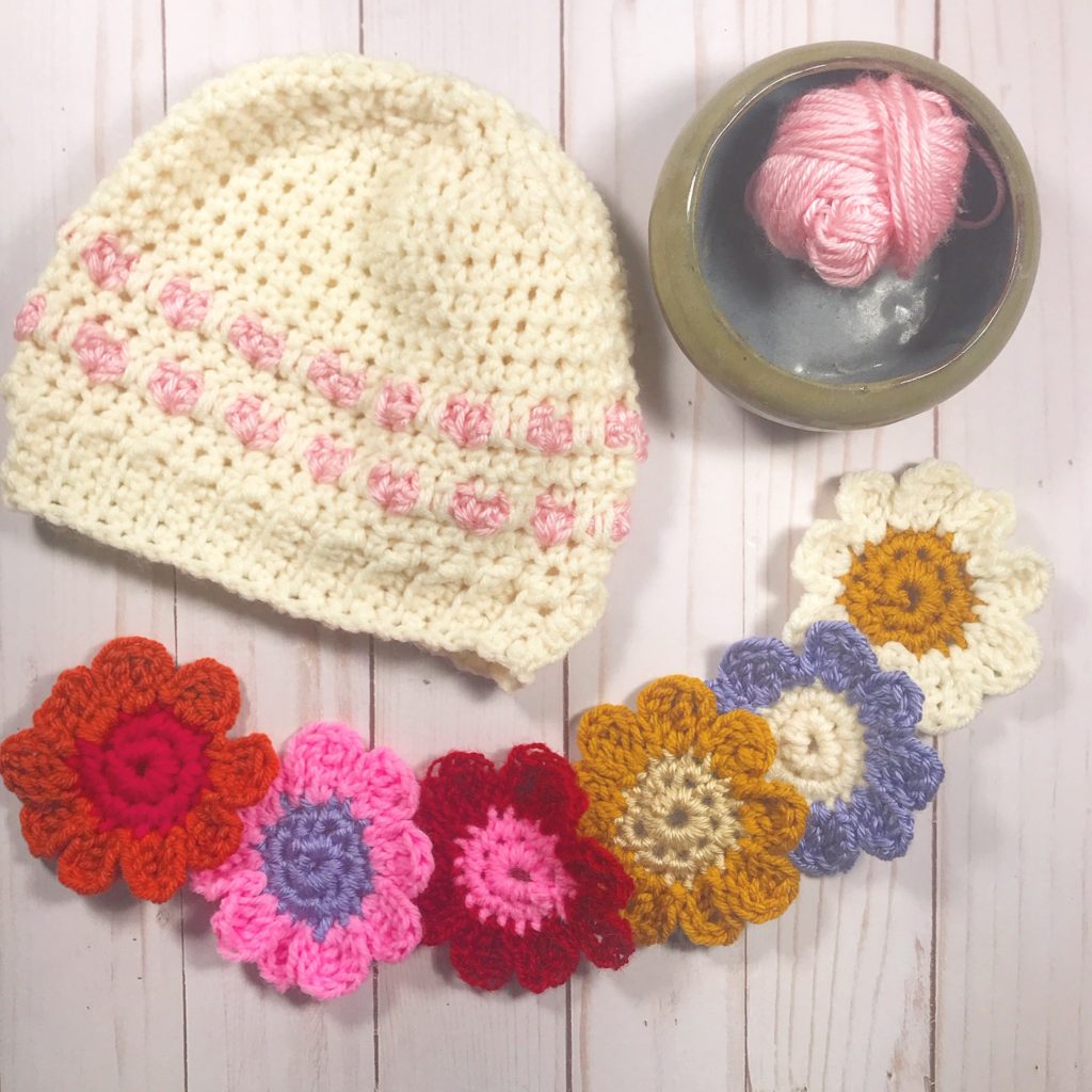 Crochet projects made from a crochet book with patterns for babies